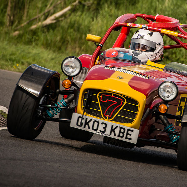 Lotus 7 Club Speed Championships, Curborough, #50 yellow and red caterham 7 rounding the fradley hairpin corner at curborough sprint track