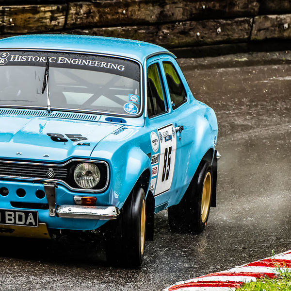 Classic Nostalgia 2019, Shelsley Walsh Hill Climb, #44 blue ford escort mark one racing car at speed on shelsley walsh hill climb circuit