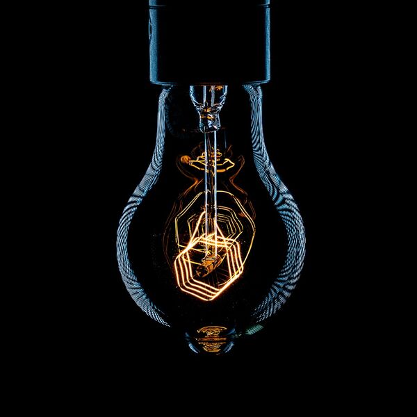 steve-shelley-ssshoot-covid-lockdown-037 vintage light bulb with orange filament and rim light