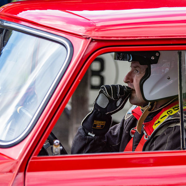 Classic Nostalgia 2019, Shelsley Walsh Hill Climb, #55 racing driver in a red mini cooper looking pensive before his run up shelsley walsh