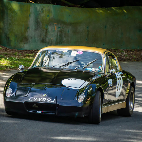 Porsche at Prescott 2019, #20 black classic lotus elan at speed during the porsche at prescott hill climb event