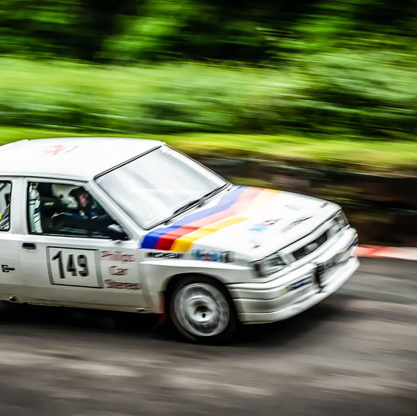 Classic Nostalgia 2019, Shelsley Walsh Hill Climb, #11 mobil oil vauxhall nova racing car at speed on shelsley walsh hill climb circuit