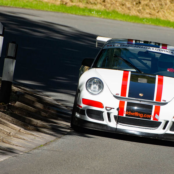 Porsche at Prescott 2019, #37 white porsche 911 at speed during the porsche at prescott hill climb event