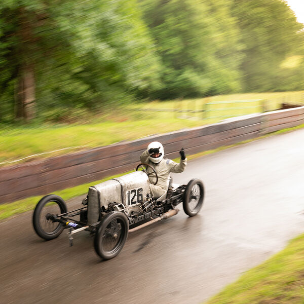ssshoot-shelsley-walsh-VSCC-04072021-21 vintage sports car driver waving at spectators at the shelsley walsh VSCC event