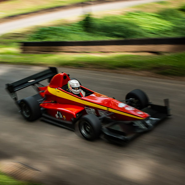 Best of British 2019, Shelsley Walsh, #12 red single seat racing car with motion blur on shelsley walsh hill climb at speed