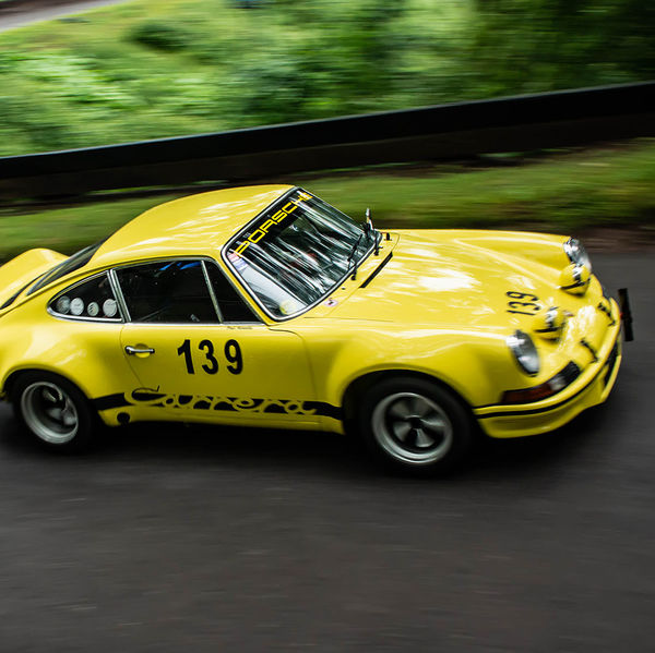Classic Nostalgia 2019, Shelsley Walsh Hill Climb, #14 yellow classic porsche 911 racing car at speed on shelsley walsh hill climb circuit