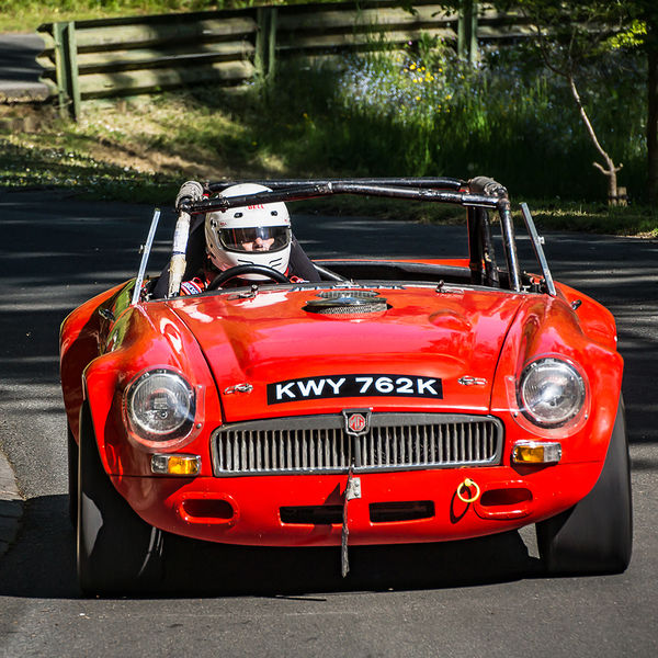 La Vie en Bleu 2019, Prescott Speed Hill Climb, #10 red mgb roadster classic sports car at speed through the corners at prescott hill climb