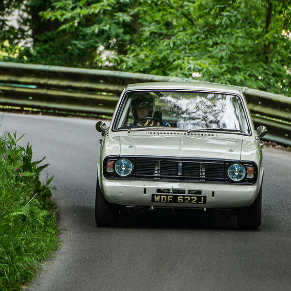 La Vie en Bleu 2019, Prescott Speed Hill Climb, #22 white classic ford cortina mark two takes the bend at speed on prescoot hill climb