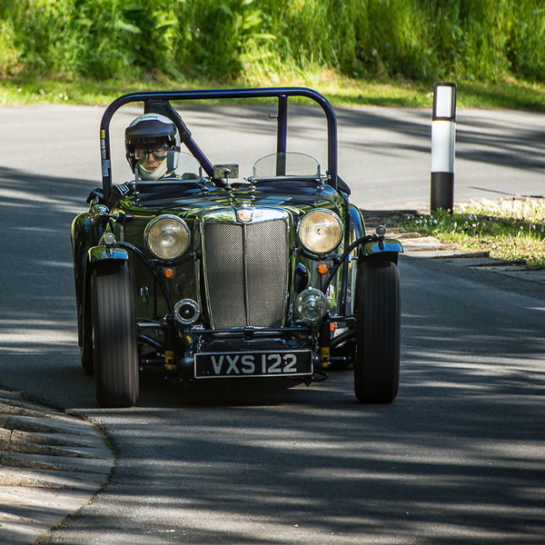 La Vie en Bleu 2019, Prescott Speed Hill Climb, #03 green vintage mg racing car at speed through the corners on prescott hill