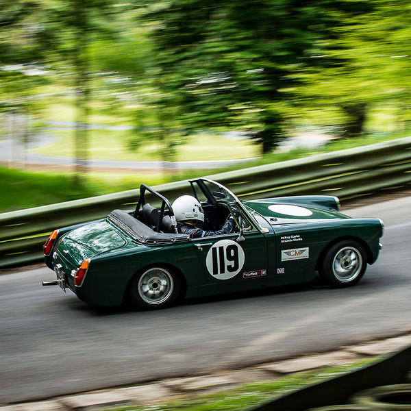 La Vie en Bleu 2019, Prescott Speed Hill Climb, #51 green classic mg midget sports car speeding through the corners at prescott hill climb