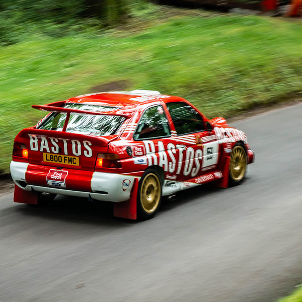 Classic Nostalgia 2019, Shelsley Walsh Hill Climb, #30 red ford escort cosworth racing car at speed on shelsley walsh hill climb circuit