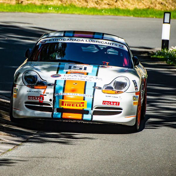 Porsche at Prescott 2019, #50 white blue and orange porsche 911 at speed during the porsche at prescott hill climb event
