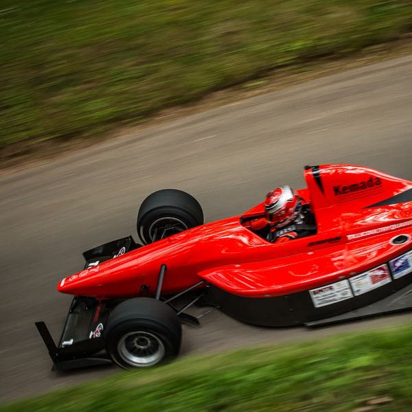 Best of British 2019, Shelsley Walsh, #65 red single seat race car at speed close to banking at shelsley walsh