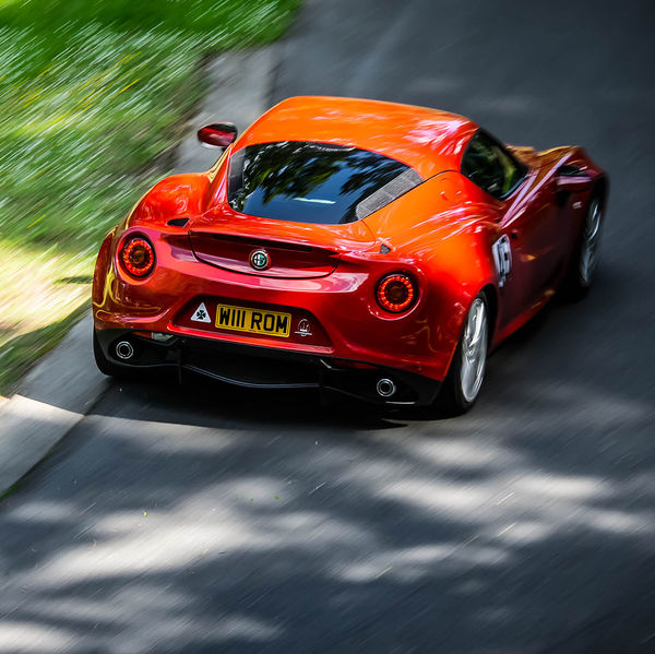 Porsche at Prescott 2019, #64 red alfa romeo 4c at speed during the porsche at prescott hill climb event