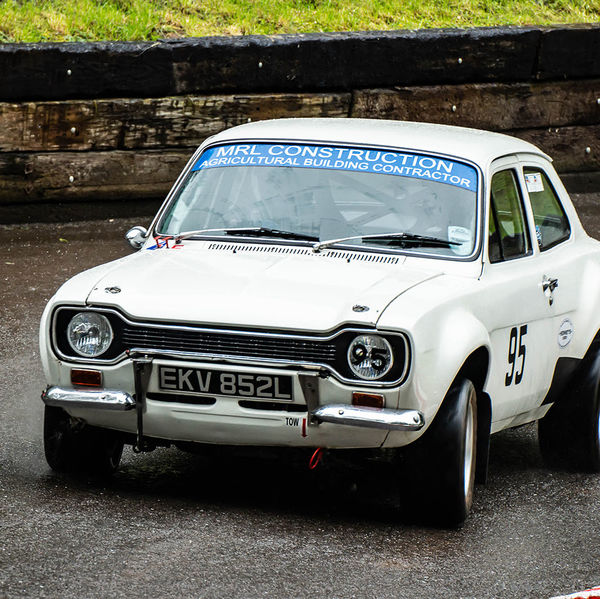 Classic Nostalgia 2019, Shelsley Walsh Hill Climb, #45 white ford escort mark one racing car at speed on shelsley walsh hill climb circuit