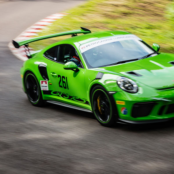 Best of British 2019, Shelsley Walsh, #48 green porsche GT3 RS race car attacking shelsley walsh hill climb at speed