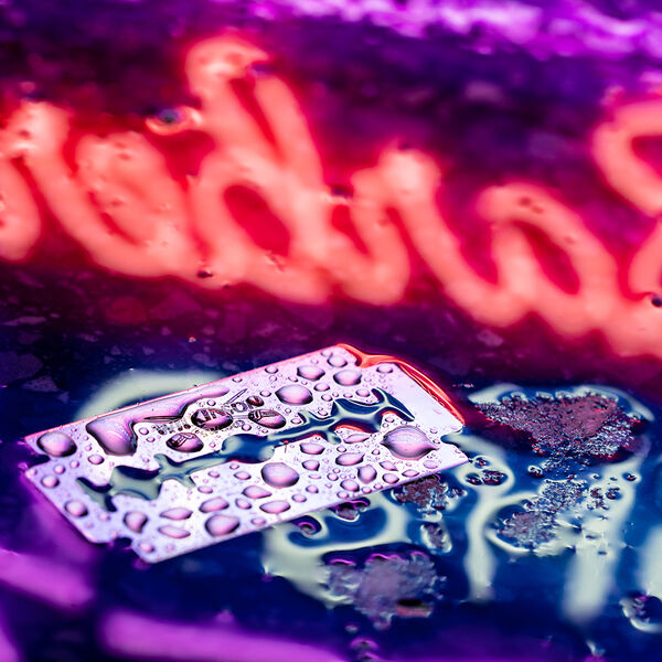 steve-shelley-ssshoot-covid-lockdown-067 wilkinson sword razor blade in water with colourful barber shop background