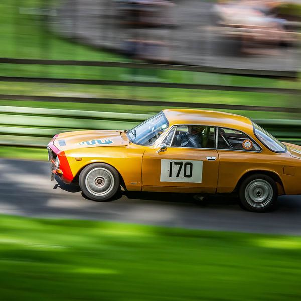 Porsche at Prescott 2019, #11 yellow classic alfa romeo at speed during the porsche at prescott hill climb event