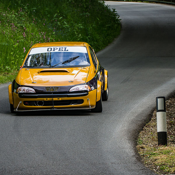 La Vie en Bleu 2019, Prescott Speed Hill Climb, #21 orange vauxhall tigra racing car through the s bends at prescott hill climb