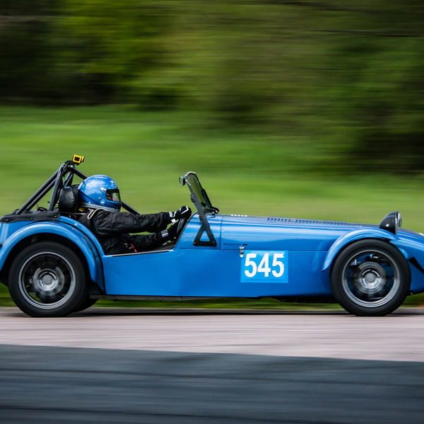 Lotus 7 Club Speed Championships, Curborough, #18 Blue caterham 7 at speed approaching flag pole corner at curborough sprint course