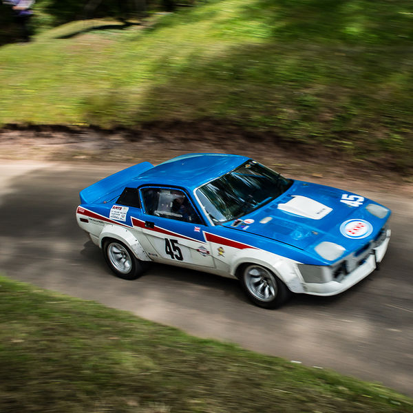 Best of British 2019, Shelsley Walsh, #27 red white and blue TR7 rally car on shelsley walsh hill climb at speed
