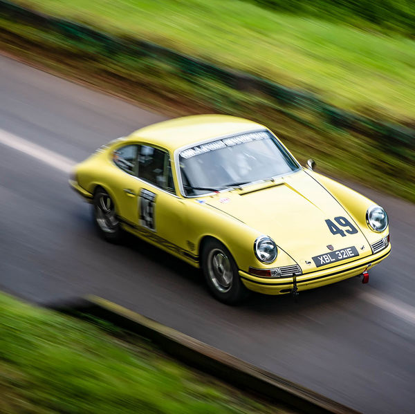 Classic Nostalgia 2019, Shelsley Walsh Hill Climb, #04 yellow classic porsche 911 racing car at speed on shelsley walsh hill climb circuit