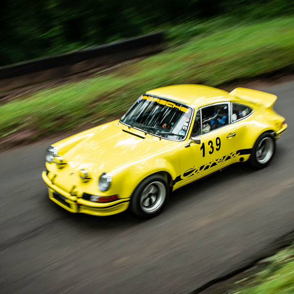 Classic Nostalgia 2019, Shelsley Walsh Hill Climb, #33 yellow classic porsche 911 racing car at speed on shelsley walsh hill climb circuit