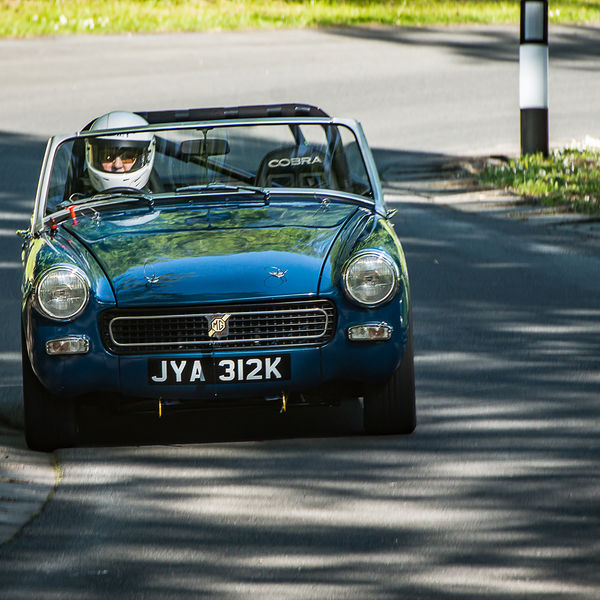 La Vie en Bleu 2019, Prescott Speed Hill Climb, #09 green classic mg sports car at speed through the corners at prescott hill climb