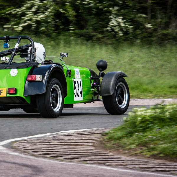 Lotus 7 Club Speed Championships, Curborough, #14 Bright green Caterham 7 at speed round flag pole corner at shenstone sprint course
