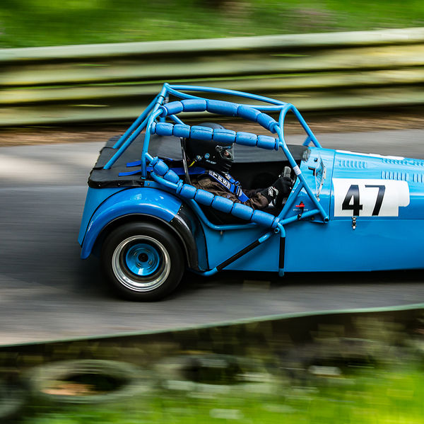 La Vie en Bleu 2019, Prescott Speed Hill Climb, #36 blue lotus 7 replica racing car travelling at speed up the prescott hill climb course