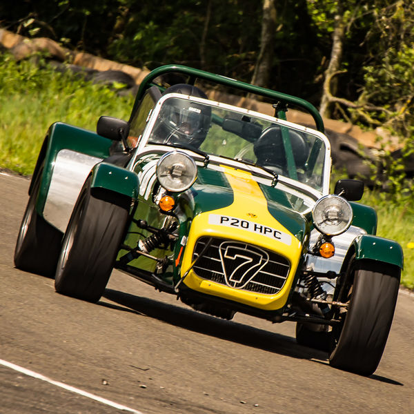 Lotus 7 Club Speed Championships, Curborough, #28 green and yellow caterham 7 at speed through curborough sprint course mole hill corner