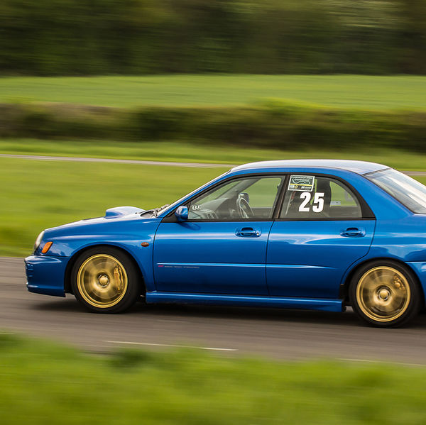 British Motorsports Marshals Sprint, Curborough Sprint Course, #33 blue subaru impreza speeding along the curborough sprint straight