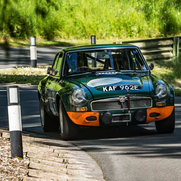 La Vie en Bleu 2019, Prescott Speed Hill Climb, #11 green mgb classic sports car at speed through the corners at prescott hill climb