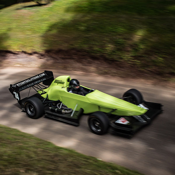 Best of British 2019, Shelsley Walsh, #35 lime green single seat racing car on shelsley walsh hill climb at speed