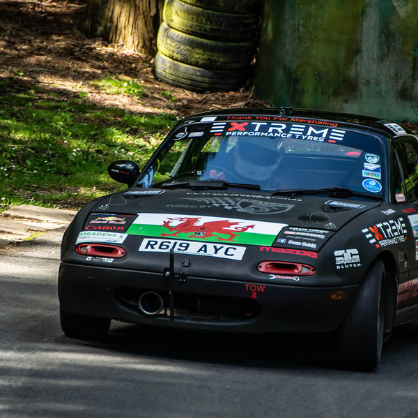 Porsche at Prescott 2019, #19 welsh liveried mazda mx5 at speed during the porsche at prescott hill climb event