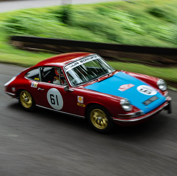 Classic Nostalgia 2019, Shelsley Walsh Hill Climb, #51 red and blue classic porsche 911 racing car at speed on shelsley walsh hill climb circuit