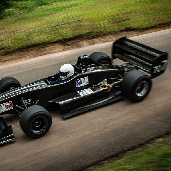 Best of British 2019, Shelsley Walsh, #14 black stealth single seat racing car descending shelsley walsh hill climb at speed