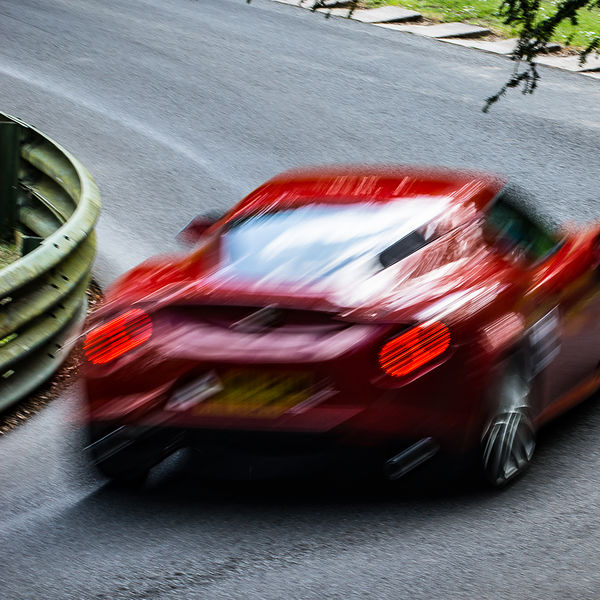 La Vie en Bleu 2019, Prescott Speed Hill Climb, #17 blurred artistic shot of a ferrari rounding a corner at speed on prescott hill