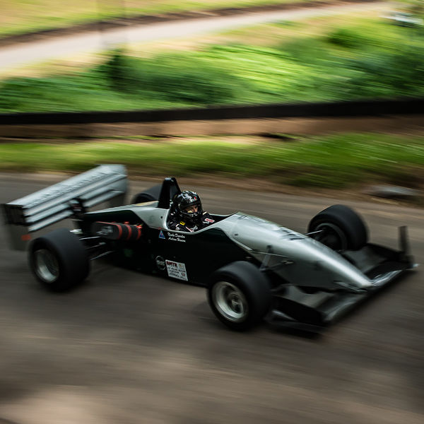Best of British 2019, Shelsley Walsh, #13 panning shot with motion blur of silver single seat racing car on shelsley walsh hill climb at speed