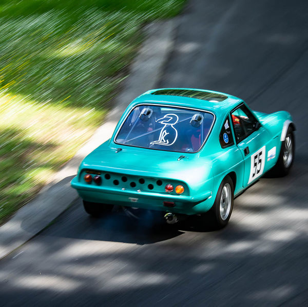 Porsche at Prescott 2019, #65 turquoise classic ginetta at speed during the porsche at prescott hill climb event