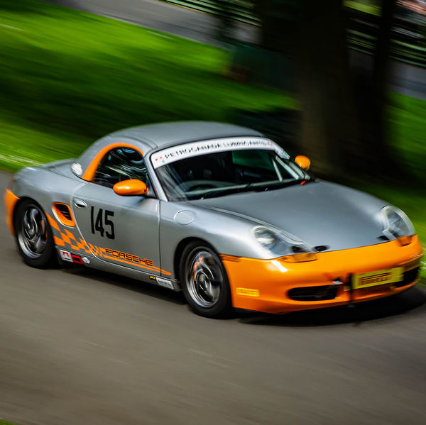 Porsche at Prescott 2019, #45 silver porsche boxster at speed during the porsche at prescott hill climb event