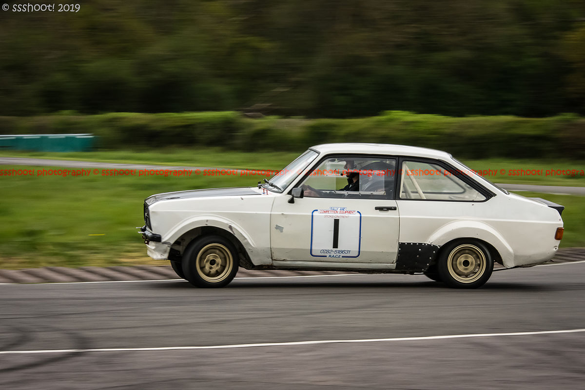 White ford escort mark 2 at speed on Curborough Sprint Course with opposite lock