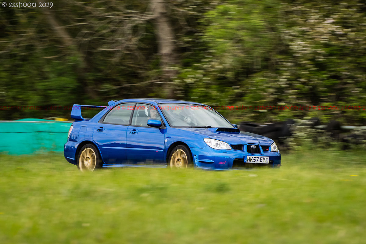 Blue Subaru Impreza Sti at speed on Curborough Sprint Course