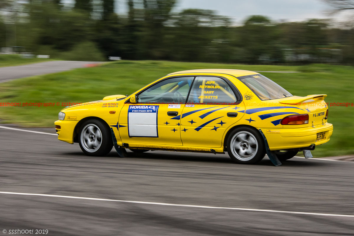 Yellow Subaru Impreza at speed on Curborough Sprint Course