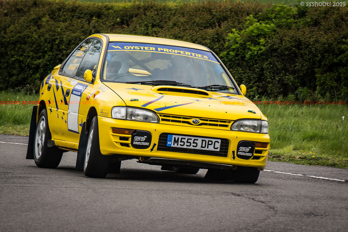 Yellow Subaru Impreza turning into the hairpin at speed on Curborough Sprint Course