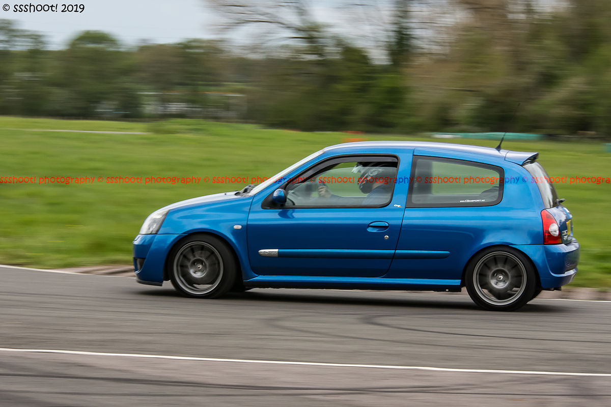 Blue Renault Clio taking the hairpin at speed on Curborough Sprint Course