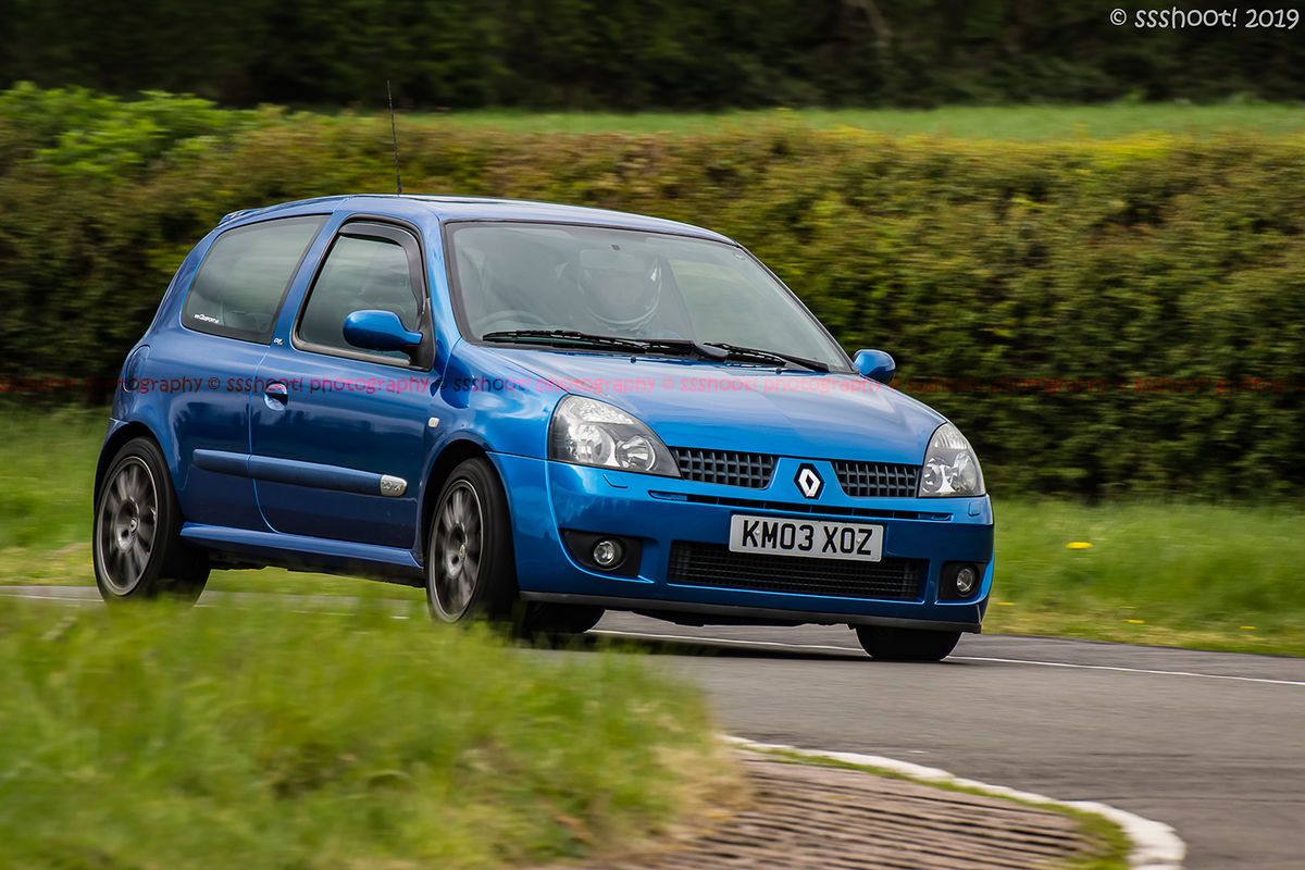 Blue Renault Clio taking the hairpin at speed on Curborough Sprint Course