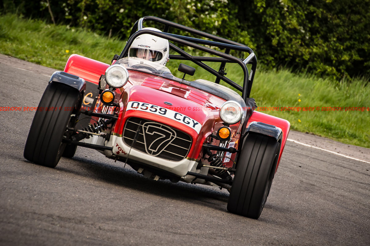 red caterham 7 rounding the fradley hairpin corner at curborough sprint track