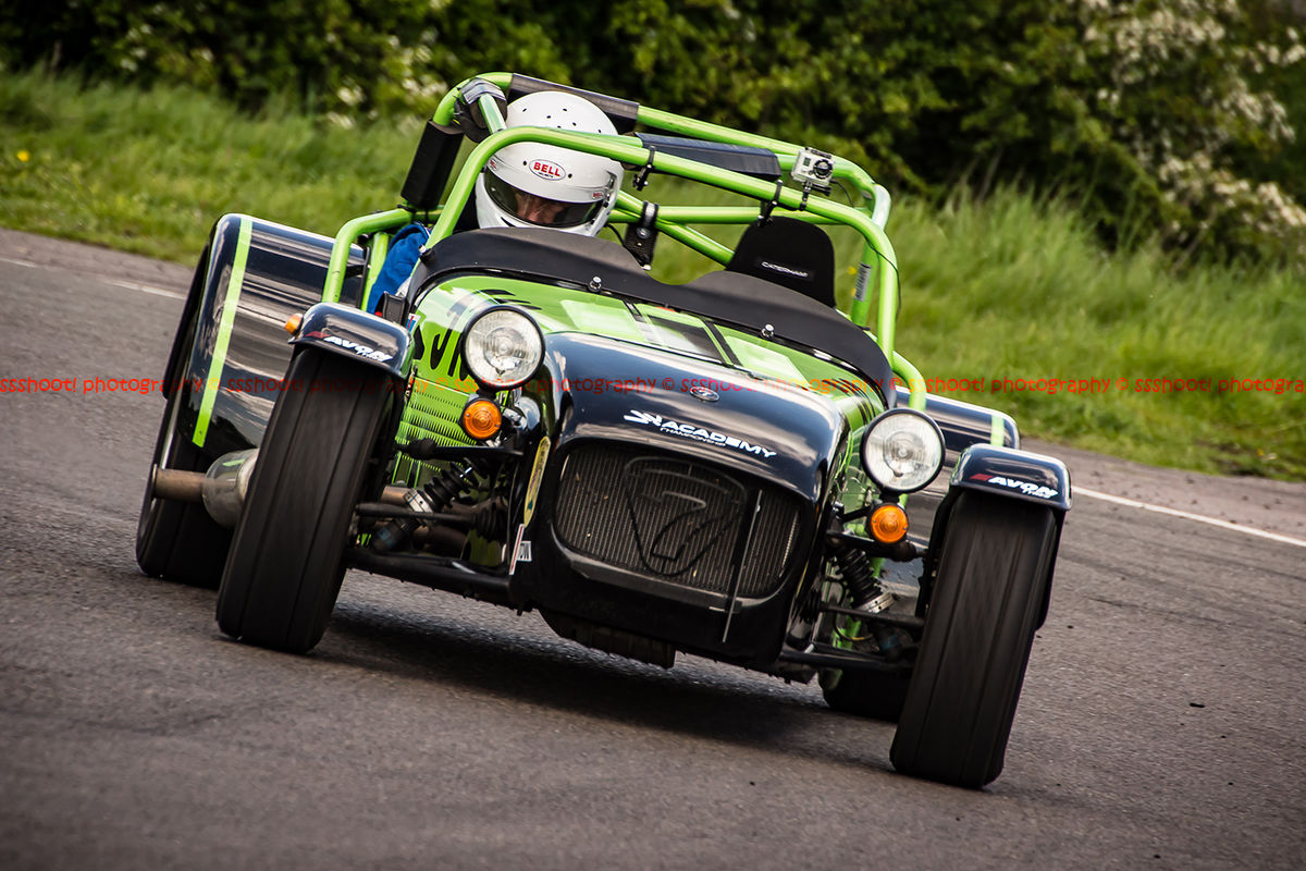 lime green caterham 7 rounding the fradley hairpin corner at curborough sprint track