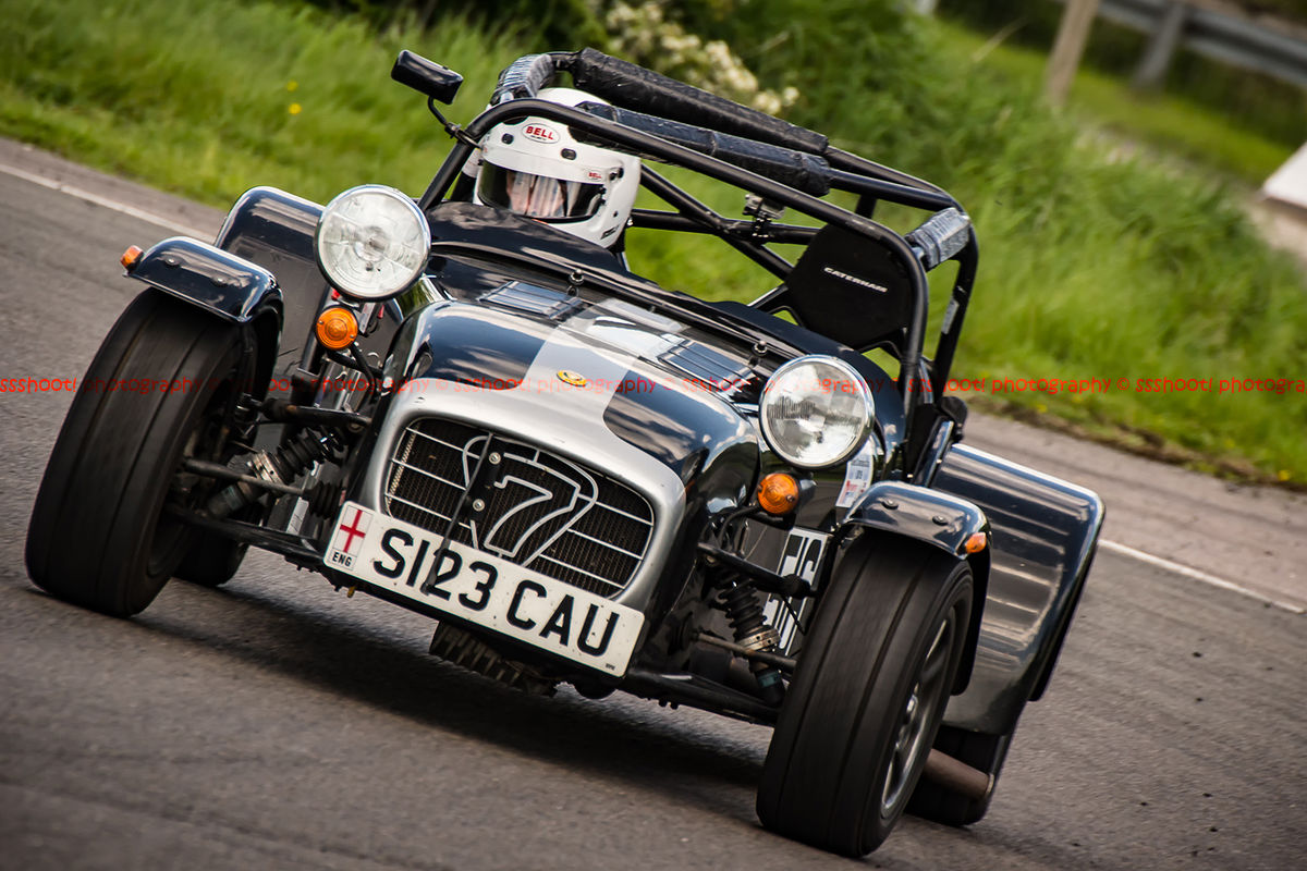 black and silver caterham 7 rounding the fradley hairpin corner at curborough sprint track